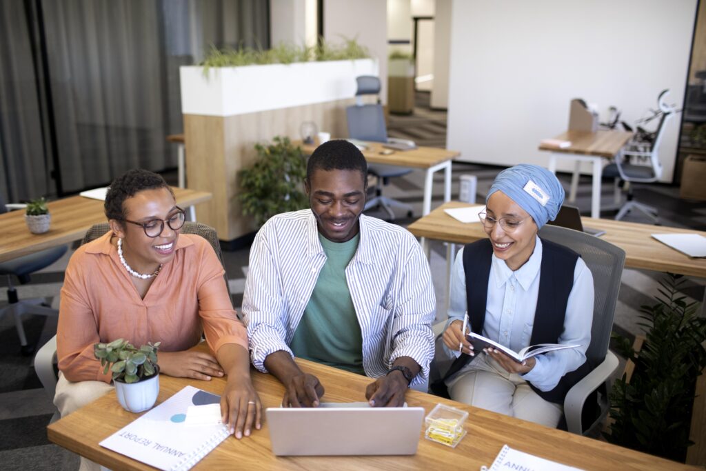 staff working together at a table with the goal of streamlining office operations